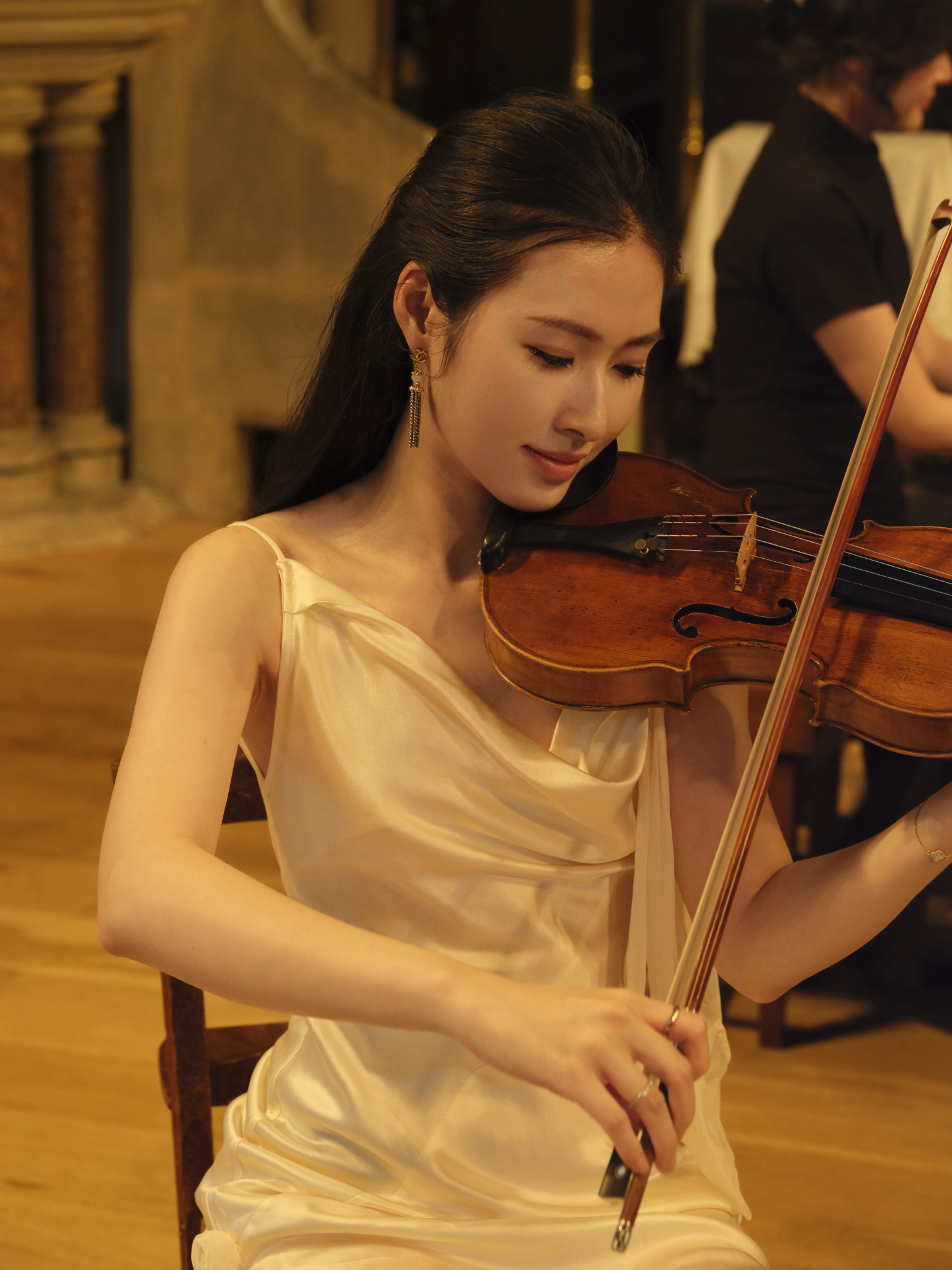 Violin performance in a warm concert setting